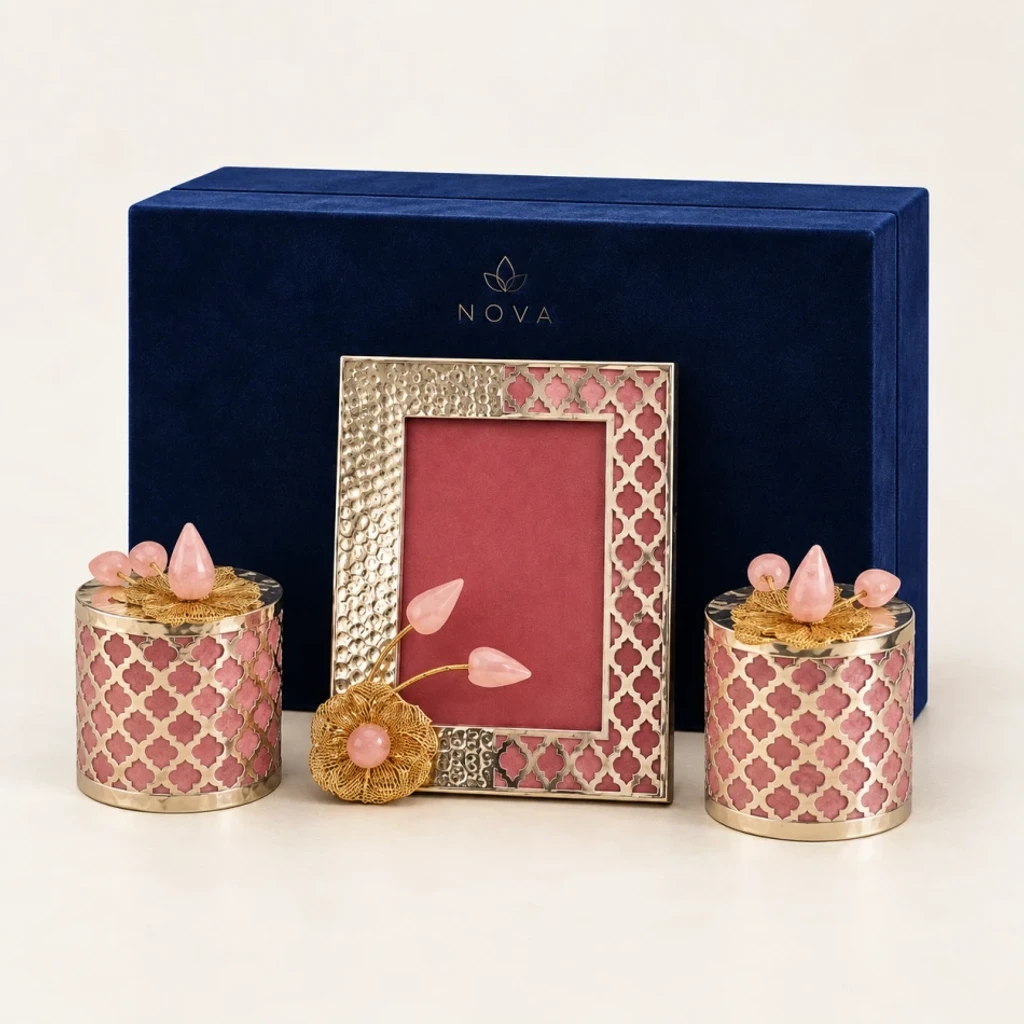 Rose quartz crystal blossom frame and gold filigree jars in presentation box